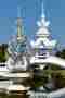 Wat Rong Khun lotus flame statue and bridge pavilion